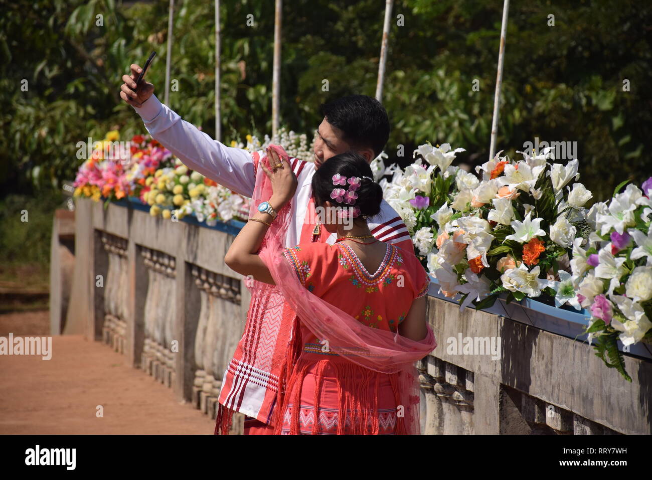 Burmese Couple Taking Selfie On A Bridge Nearby Kyauk Ka Lat Pagoda In Hpa An Myanmar Stock 