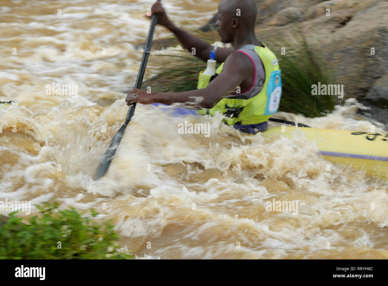 Durban, KwaZulu-Natal, South Africa, adult man, paddle stroke, canoe, whitewater river, 2019 FNB Canoe Marathon, canoeing, blur, splash, people Stock Photo