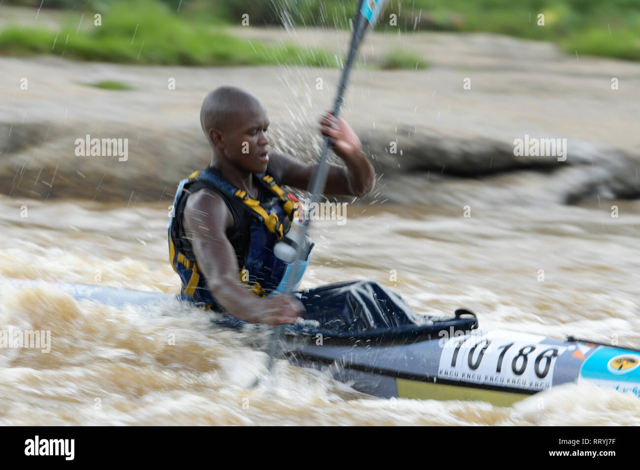 Durban, KwaZulu-Natal, South Africa, blur, single adult man canoeing, 2019 Dusi Canoe Marathon, paddle, people Stock Photo