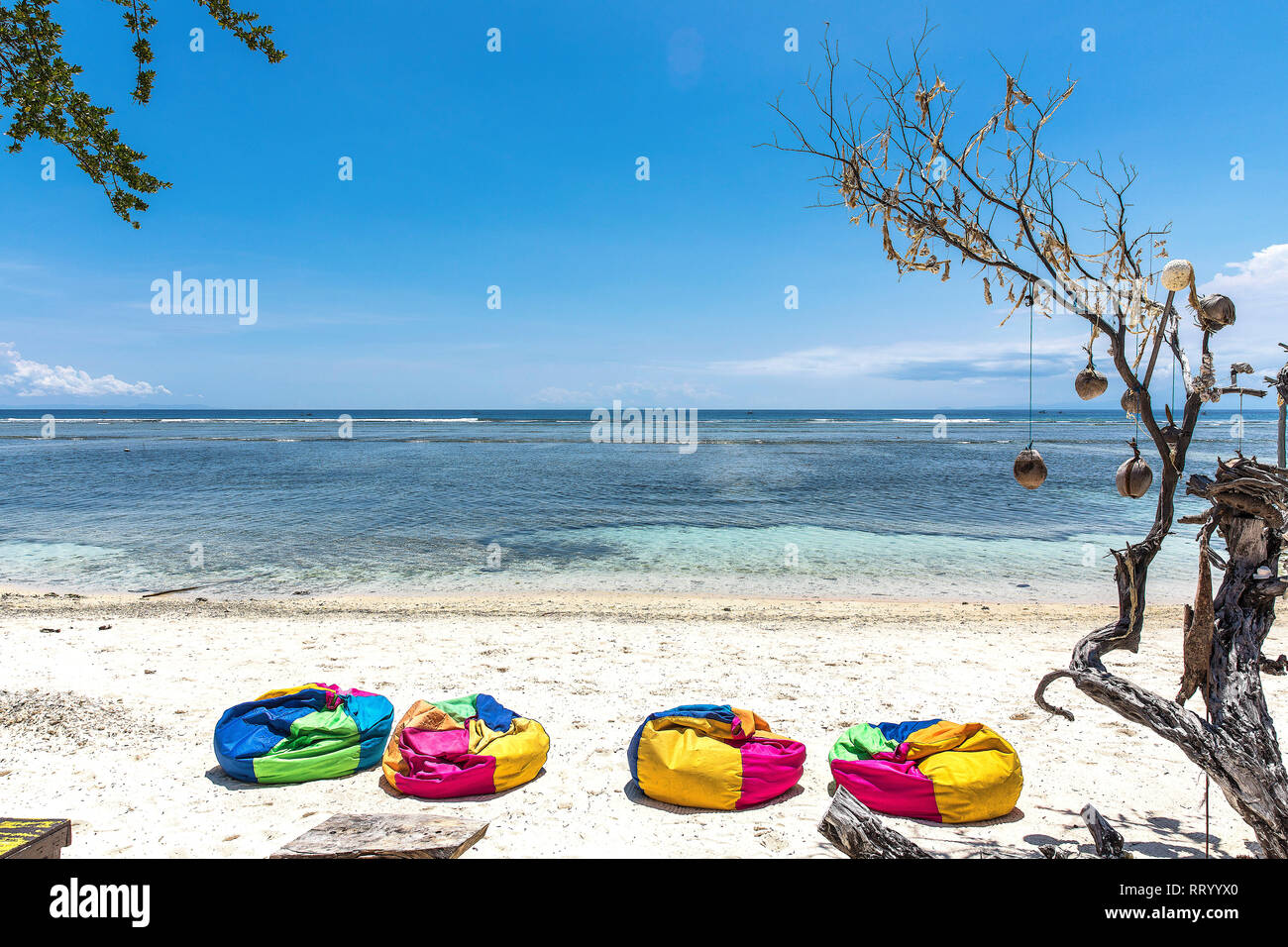 Colorful sunbeds on the beach of Gili Trawangan island, Indonesia. Stock Photo