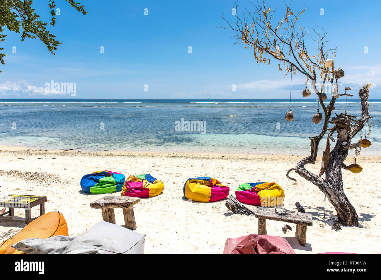 Colorful sunbeds on the beach of Gili Trawangan island, Indonesia. Stock Photo