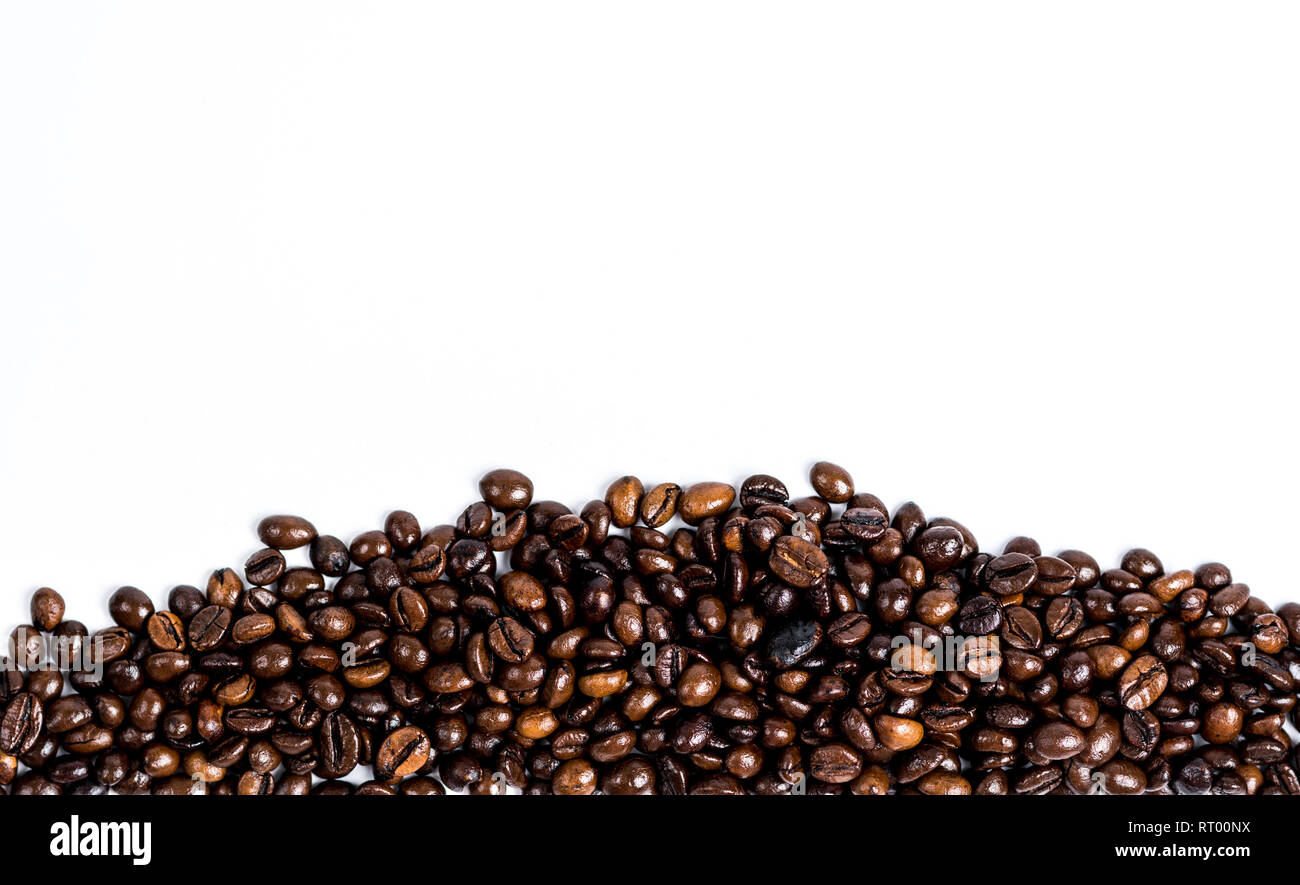 Roasted coffee bean isolated on down white background with copy space ...