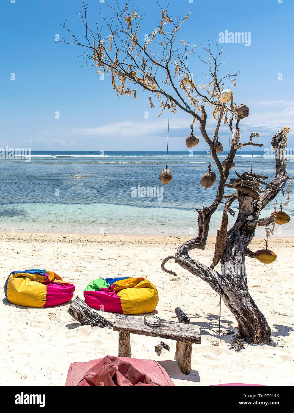 Colorful sunbeds on the beach of Gili Trawangan island, Indonesia. Stock Photo