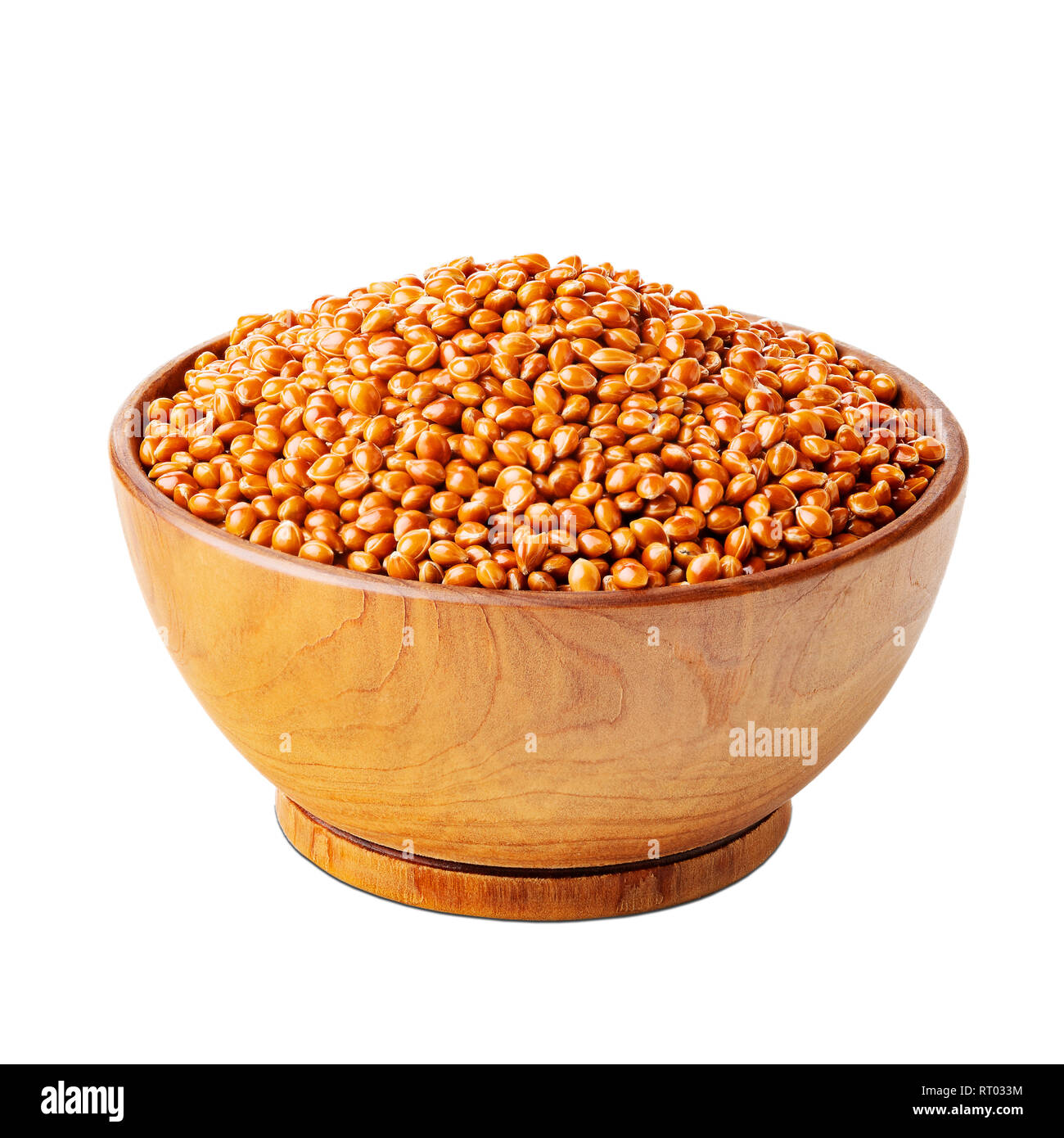 Millet with shells in a wooden bowl isolated on white Stock Photo