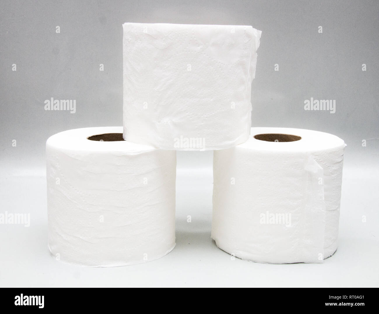 Three stacks of toilet paper Stock Photo - Alamy