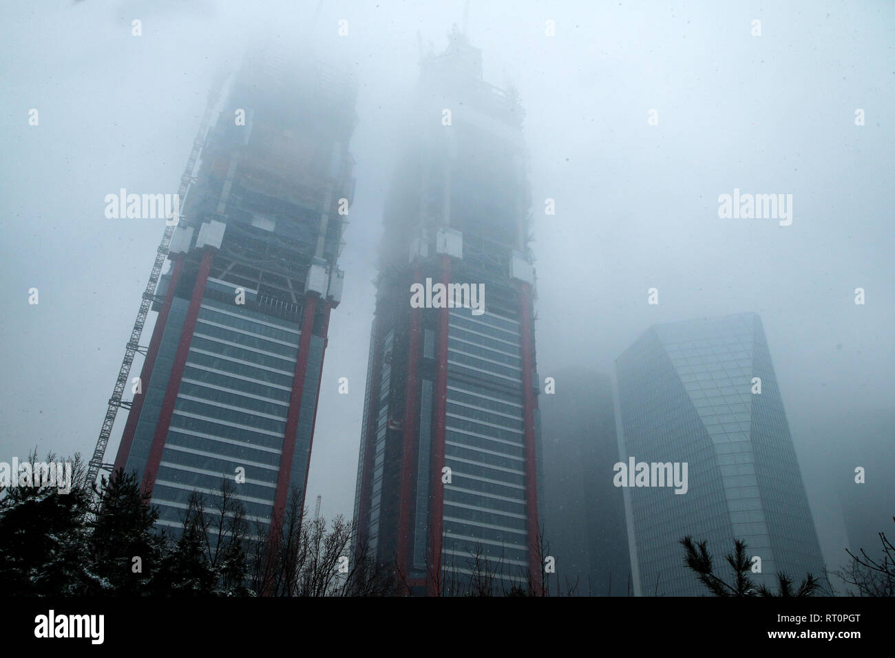Office center in Seoul, Korea, in Yeouido. The skyscrapers are hiding in the fog during the snowfall in winter. Stock Photo