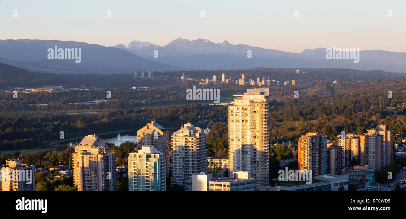 Aerial view of a modern city during a vibrant sunset. Taken in ...