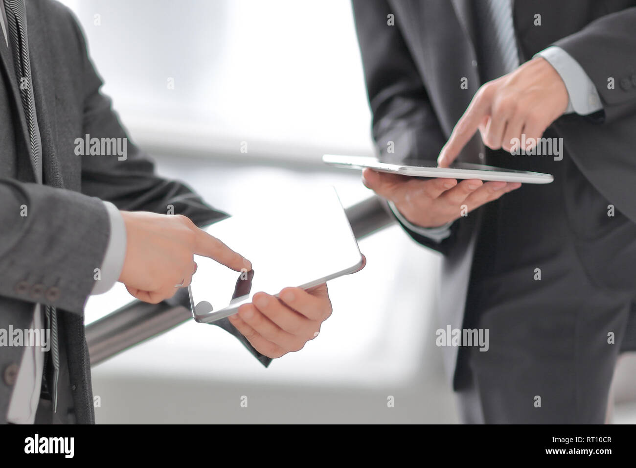 close up. two businessmen with tablet computers Stock Photo