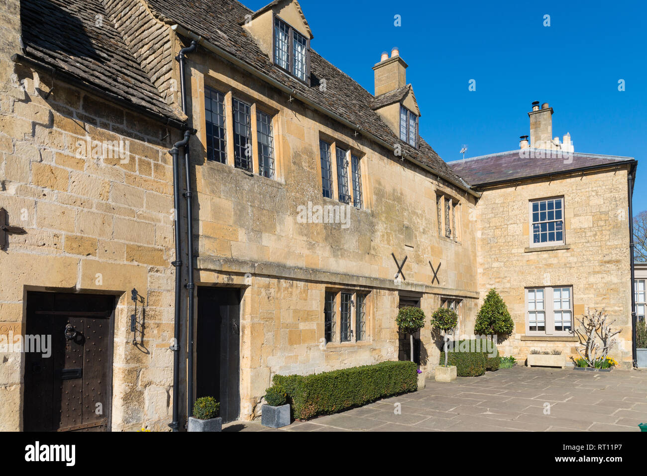 Smart Cotswold stone buildings in the pretty Cotswold market town of