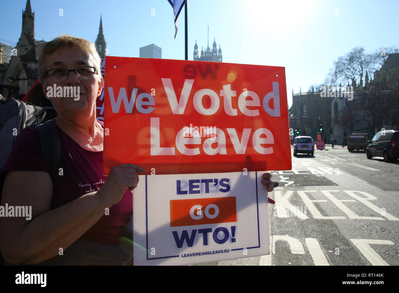 Anti-Brexit demonstrator seen holding placards during the protest outside the Houses of Parliament as British Prime Minister Theresa May outlines her plans on the United Kingdom leaving the European Union. Stock Photo