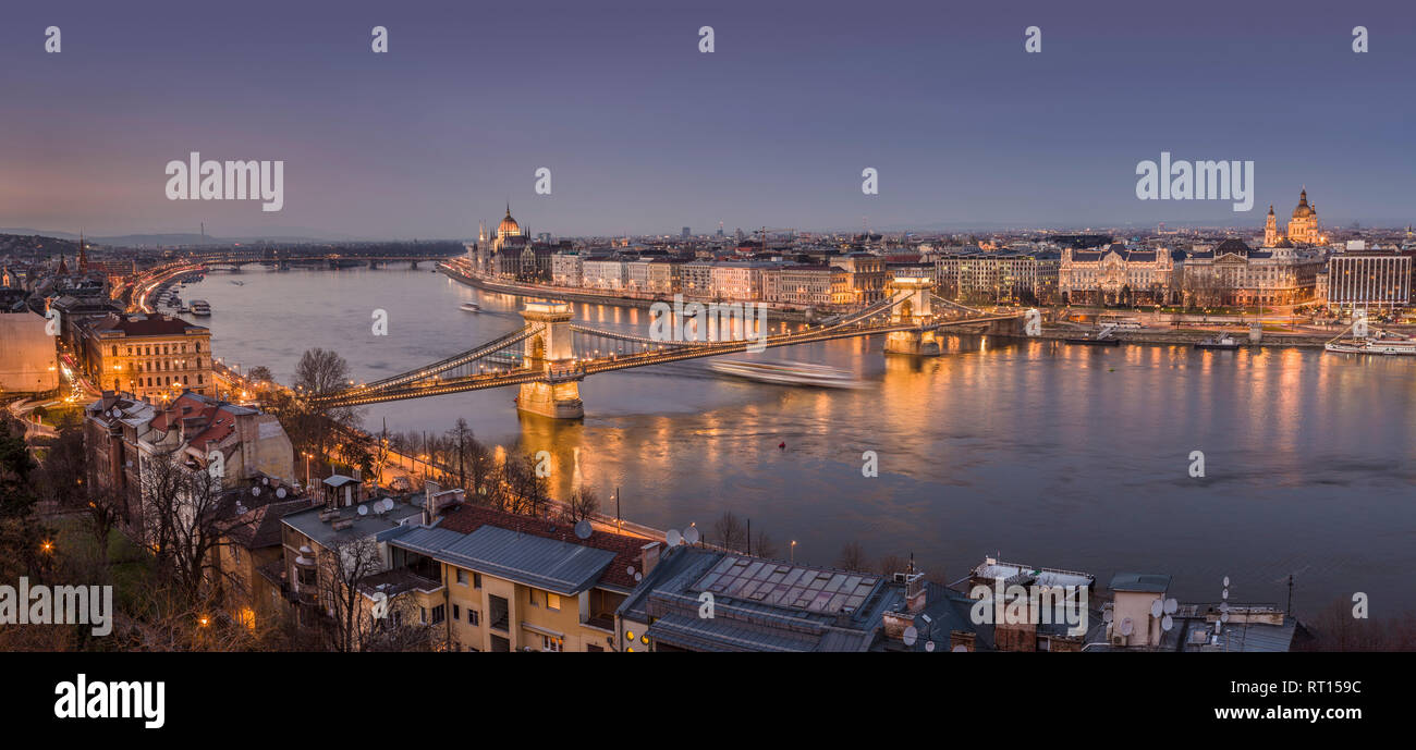 View from the Castle hill with the Széchenyi Chain Bridge, the Hungarian Parliament and the Danube river illuminated at night. Budapest, Hungary. Stock Photo