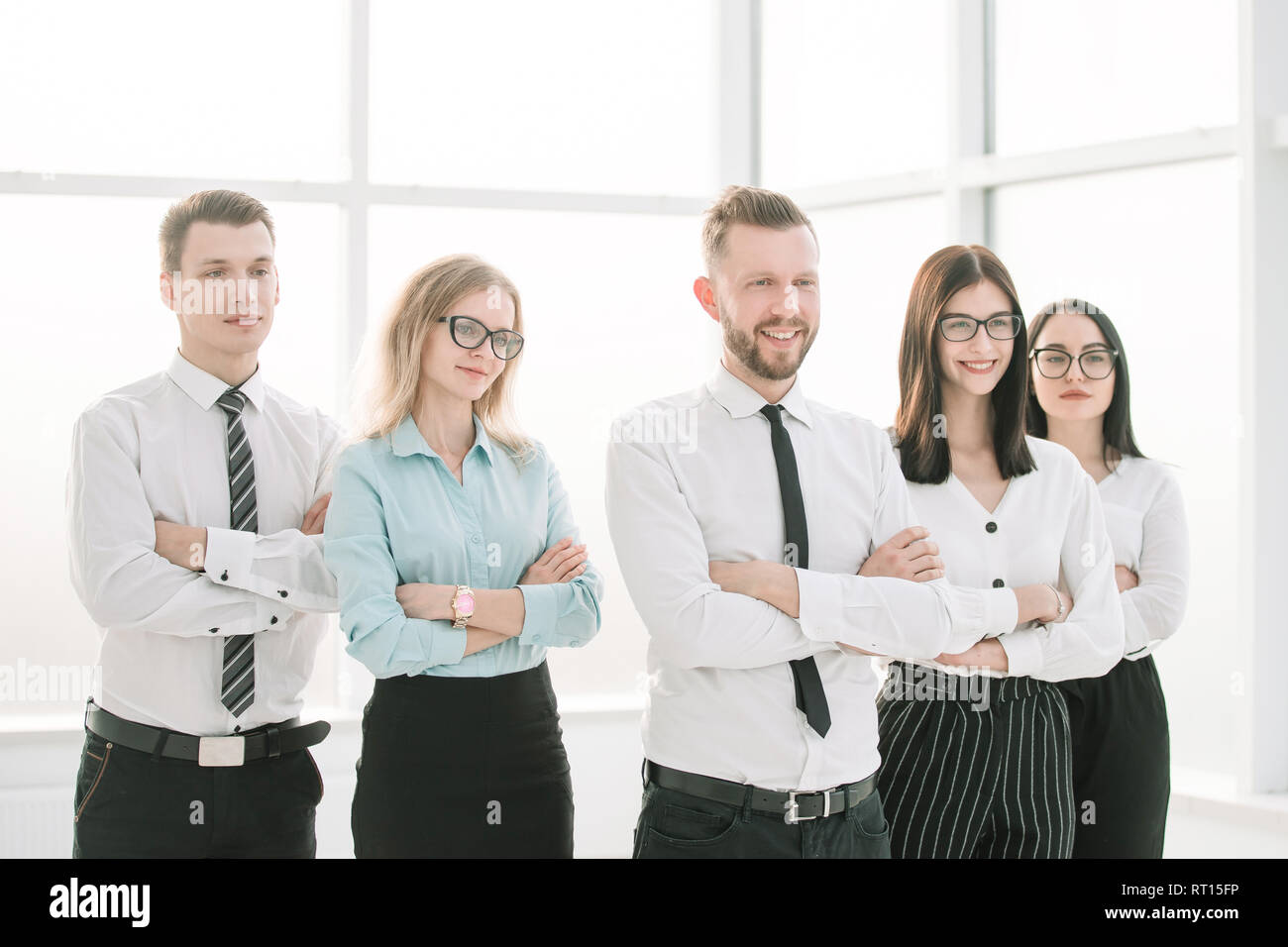 successful business team standing in a bright office Stock Photo - Alamy