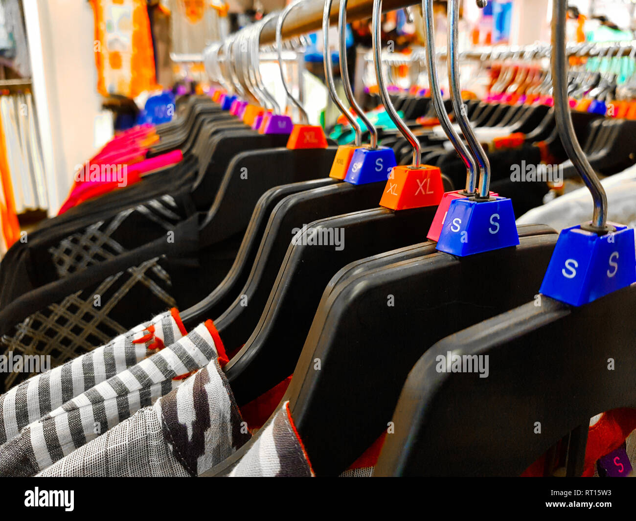 Different Sized Hanger With Colourful Dress Size Tags Xl L M Xs T Shirts Displayed In Shop For Sale Stock Photo Alamy