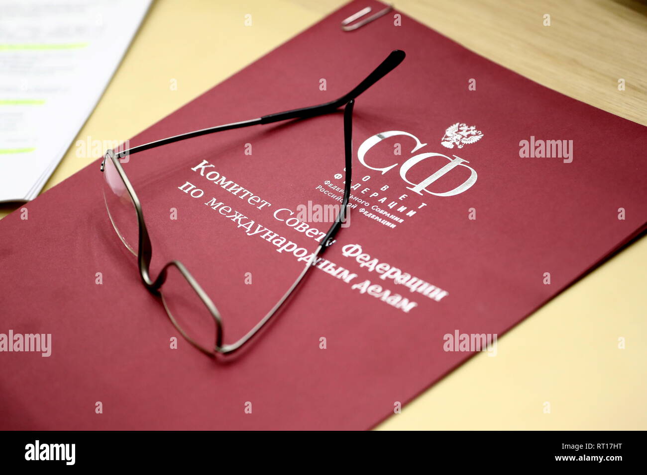 Moscow, Russia. 27th Feb, 2019. MOSCOW, RUSSIA - FEBRUARY 27, 2019: Glasses and a folder at a plenary meeting of the Russian Federation Council, the upper house of the Russian Parliament. Anton Novoderezhkin/TASS Credit: ITAR-TASS News Agency/Alamy Live News Stock Photo