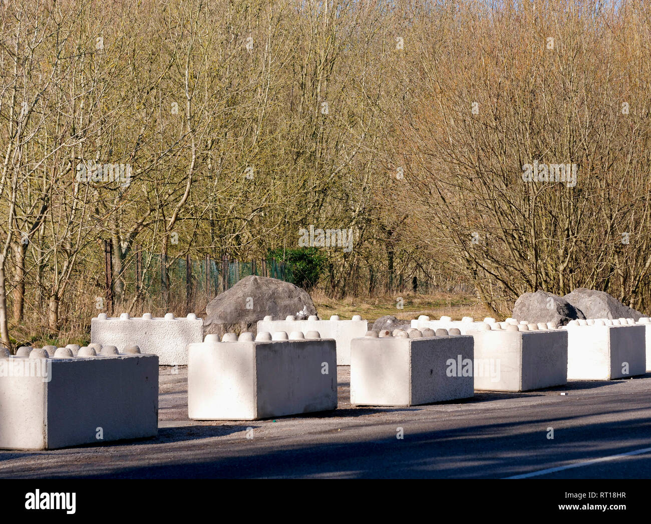Wirksworth, Derbyshire Dales, UK. 27th Feb 2019. Concrete blocks placed on the carpark to protect Wirksworth beauty spot owned by Wirksworth Town Council (Labour) after Derbyshire Dales District Council (Conservative) voted on relocating a GRT Travellers camp on disputed land adjacent to Stoney Wood, Wirksworth, Derbyshire Dales. Wirksworth Town Council are seeking legal advise to try & protect the trees, rare wild orchids & other wildlife in and around this Sight of Special scientific Interest. Credit: Doug Blane/Alamy Live News Stock Photo