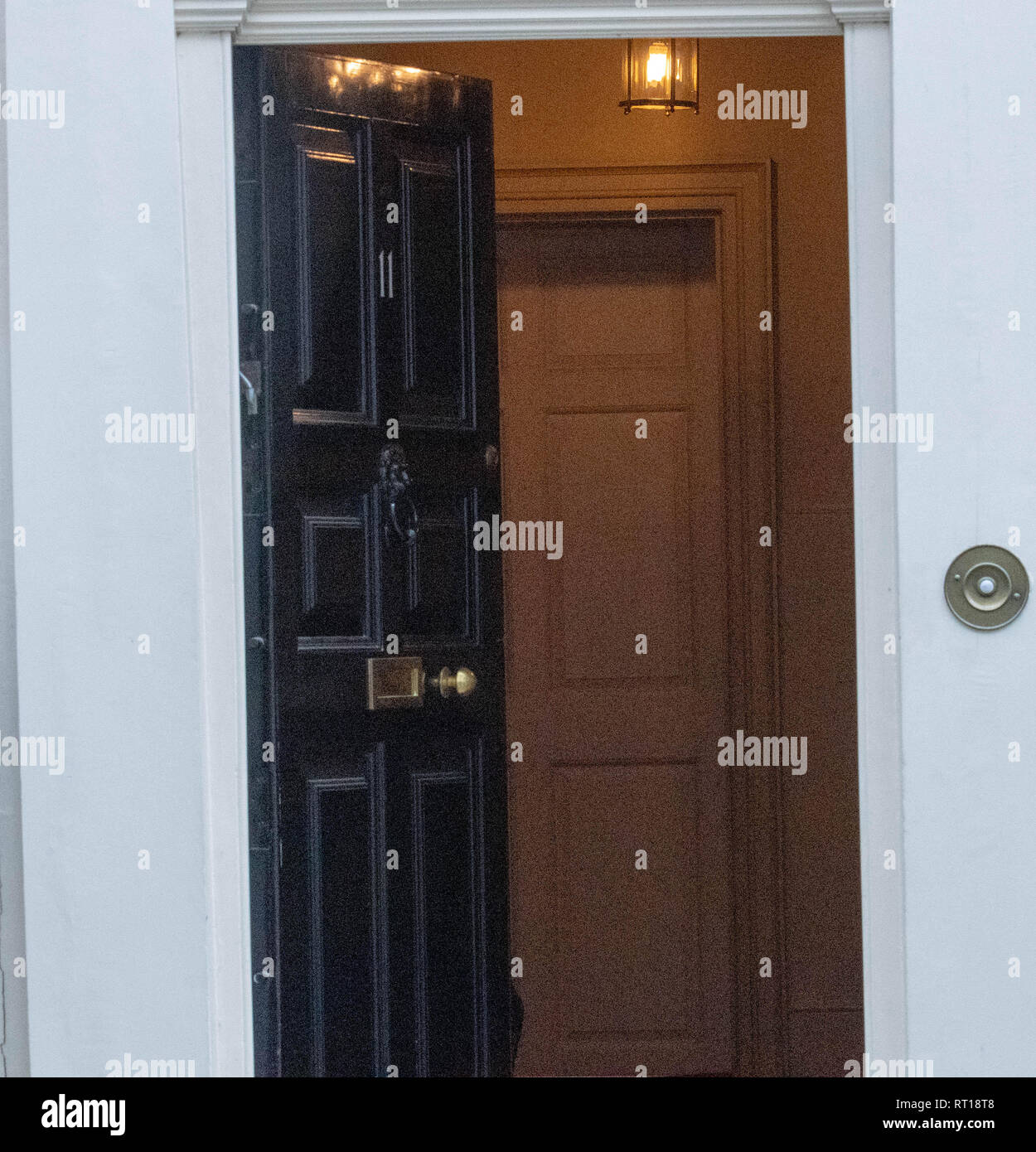 London, UK. 27th Feb 2019. In a security breach the door to 11 Downing Street, was left open after Phillip Hammond left Credit: Ian Davidson/Alamy Live News Stock Photo