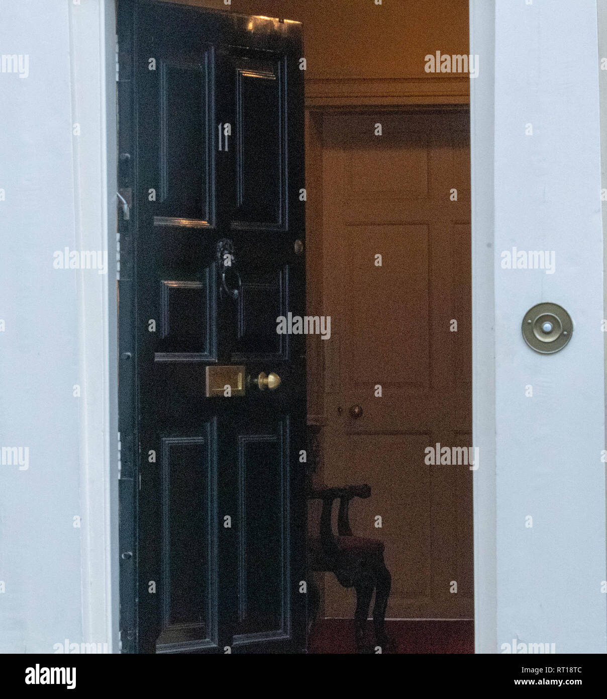 London, UK. 27th Feb 2019. In a security breach, the door to 11 Downing Street, was left open after Phillip Hammond left Credit: Ian Davidson/Alamy Live News Stock Photo