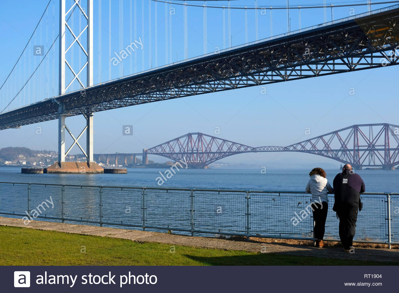 South Queensferry, United Kingdom. 27th February 2019. Unusually mild weather with sunshine at Port Edgar Marina with views of the Forth bridges. Credit: Craig Brown/Alamy Live News Stock Photo