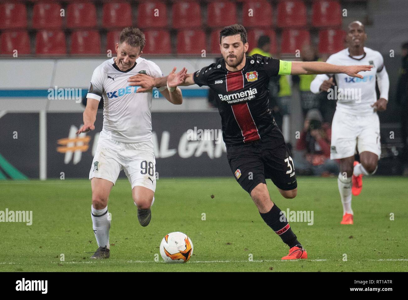 Leverkusen, Deutschland. 21st Feb, 2019. Kevin VOLLAND (LEV, r.) Tries to keep away from dueling Sergey PETROV (FK Krasnodar); Soccer Europa League, Zwischenrunde, Rückspiel Bayer 04 Leverkusen (LEV) - FK Krasnodar (FKK) 1: 1, Leverkusen is eliminated on 21/02/2019 in Leverkusen/Germany. UEFA regulations prohibit any use of images as image sequences and/or quasi-video | usage worldwide Credit: dpa/Alamy Live News Stock Photo