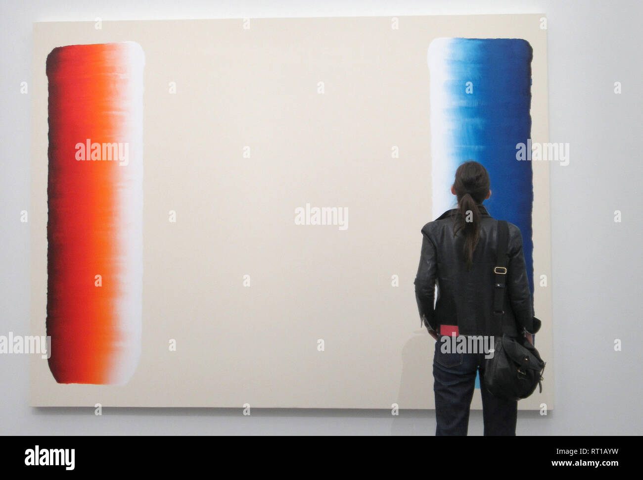26 February 2019, France (France), Metz: A visitor looks at a work from Lee Ufan's 'Dialogue' series in the exhibition 'Habiter le temps' at the Centre Pompidou. Ufan, who studied philosophy in Japan after completing his art degree, uses his art to seek a new arrangement of already existing things by relating them to the surrounding space. (to dpa 'Metz dedicates star artist Lee Ufan retrospective: The art of silence' from 27.02.2019) Photo: Sabine Glaubitz/dpa Stock Photo