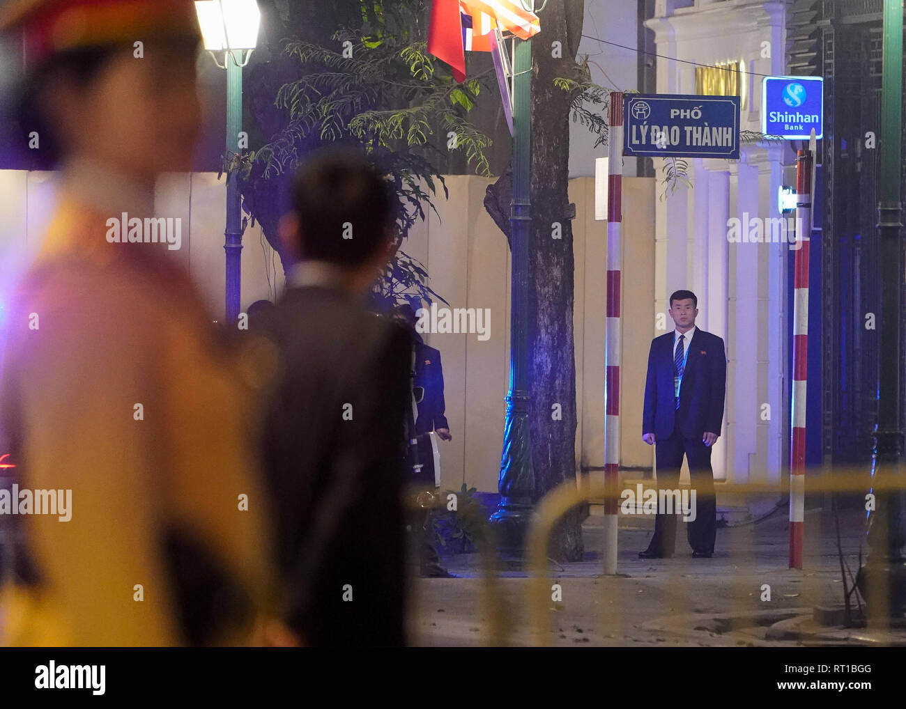 Hanoi, Vietnam. 27th Feb, 2019. February 27, 2019 - Hanoi, Vietnam - A North Korean security guard stands on a street leading to the Sofitel Legend Metropole hotel where North Korean Leader Kim Jong Un and U.S. President Donald Trump met for dinner during the second North Korea-U.S. Summit in the capital city of Hanoi, Vietnam. Credit: Christopher Jue/ZUMA Wire/Alamy Live News Stock Photo