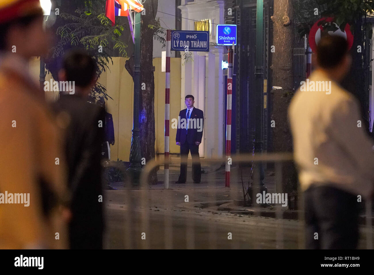 Hanoi, Vietnam. 27th Feb, 2019. February 27, 2019 - Hanoi, Vietnam - A North Korean security guard stands on a street leading to the Sofitel Legend Metropole hotel where North Korean Leader Kim Jong Un and U.S. President Donald Trump met for dinner during the second North Korea-U.S. Summit in the capital city of Hanoi, Vietnam. Credit: Christopher Jue/ZUMA Wire/Alamy Live News Stock Photo