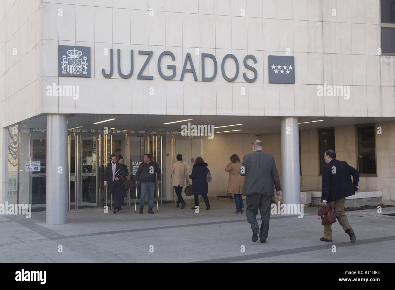 Madrid, Spain. 27th Feb, 2019. A view of Entry to the Courts of First Instance of Plaza Castilla during the protest.The ADICAE association presents 107 collective lawsuits and launches a campaign to inform the mortgaged of their right to recover what was improperly charged by the banking entities and to help them exercise it quickly and effectively. ADICAE bases its claim on the declaration as an abusive clause by the Supreme Court in 2015 of the imposition of the entities of all expenses for the formalization of mortgages to consumers, which should end in a fast and agile compensation Stock Photo