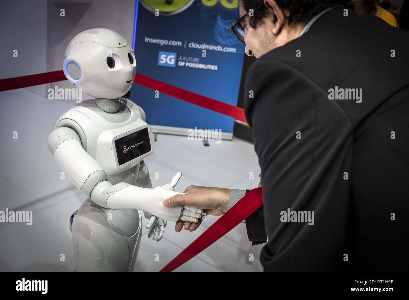 Barcelona, Catalonia, Spain. 27th Feb, 2019. The humanoid robot Pepper of  the American company CloudMinds is seen shaking hands with a visitor during  the MWC2019.The MWC2019 Mobile World Congress opens its doors