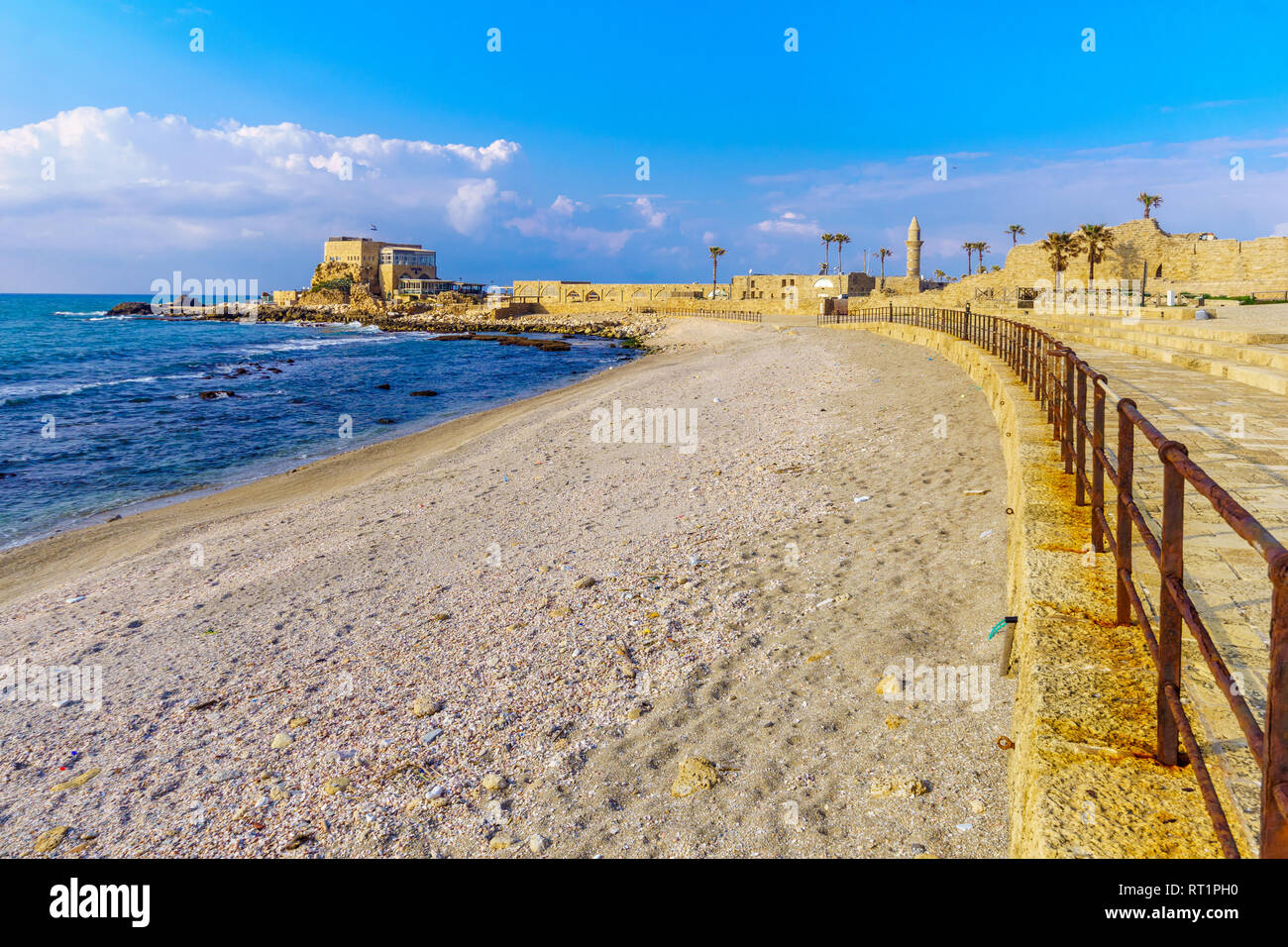 View of the beach promenade and the old port in Caesarea National Park, Northern Israel Stock Photo