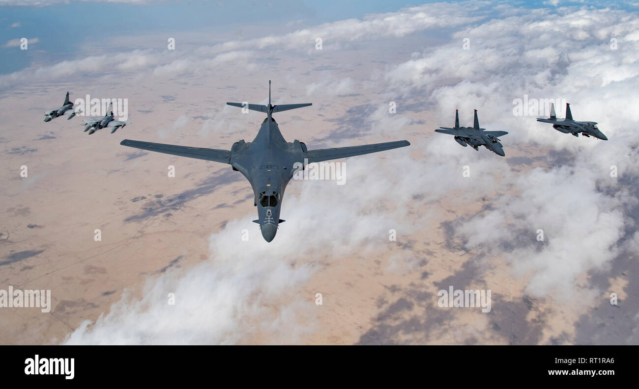 Qatari Mirage 2000s, a U.S. Air Force B-1B Lancer bomber and F-15E Strike Eagles fly in formation during Joint Air Defense Exercise 19-01, Feb. 19, 2019. JADEX provides an opportunity to strengthen military-to-military relationships with the Qatari Air Force while conducting combined air operations with partners. (U.S. Air Force photo by Staff Sgt. Clayton Cupit) Stock Photo