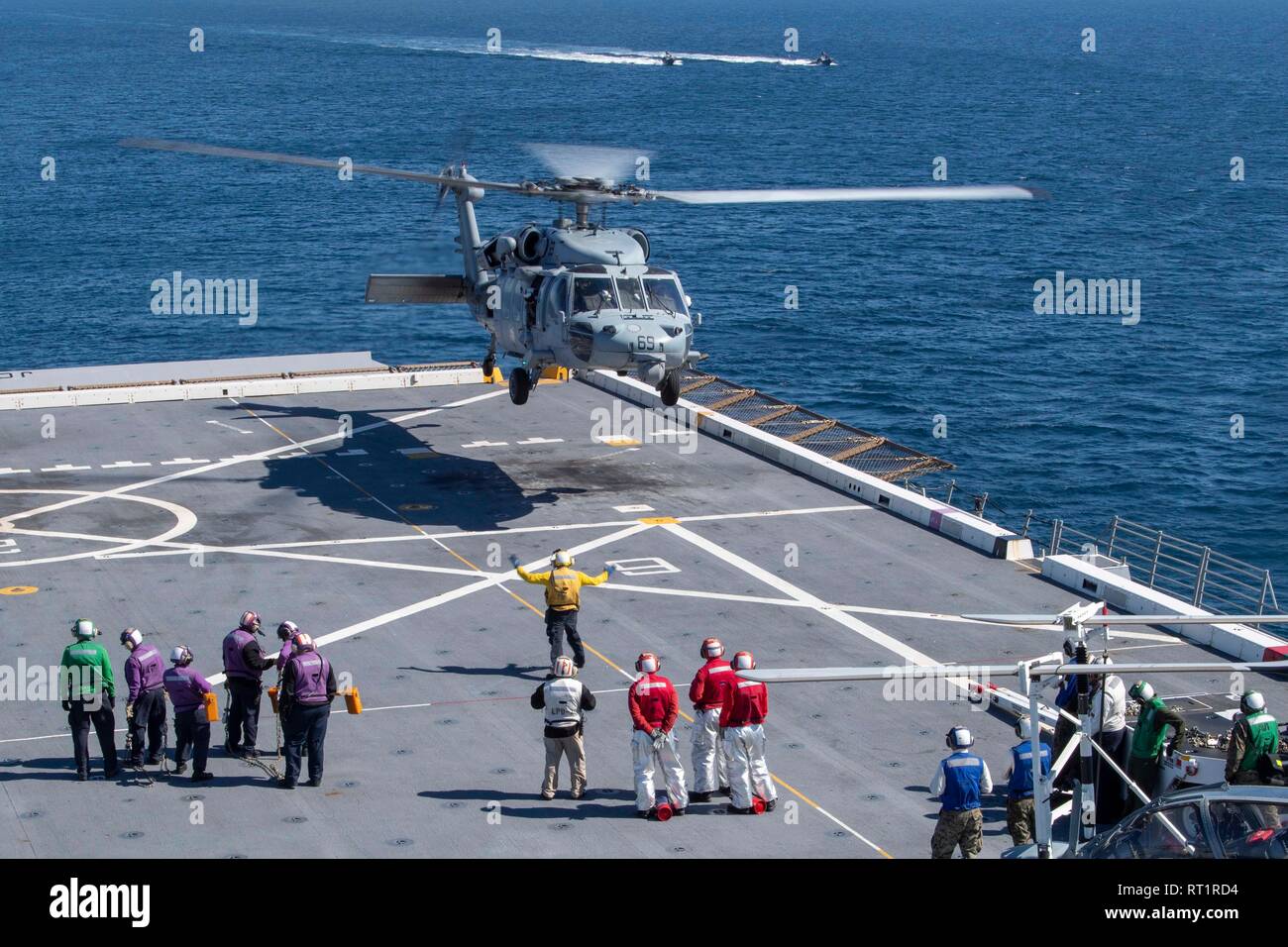 190224-N-NB544-1080 PACIFIC OCEAN (Feb. 24, 2019) An MH-60S Seahawk, assigned to Helicopter Sea Combat squadron (HSC) 21, lands on the San Antonio-class amphibious transport dock ship USS John P. Murtha (LPD 26). John P. Murtha is underway conducting routine operations as a part of USS Boxer Amphibious Ready Group (ARG) in the eastern Pacific Ocean. (U.S. Navy photo by Mass Communication Specialist 2nd Class Kyle Carlstrom) Stock Photo