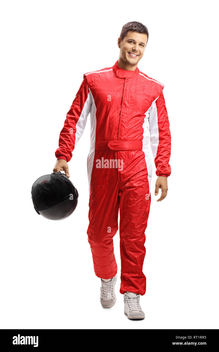 Full length portrait of a male car racer holding a helmet and walking towards the camera isolated on white background Stock Photo