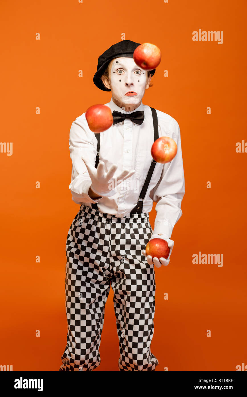 Portrait of an actor as a pantomime with whitemakeup showing