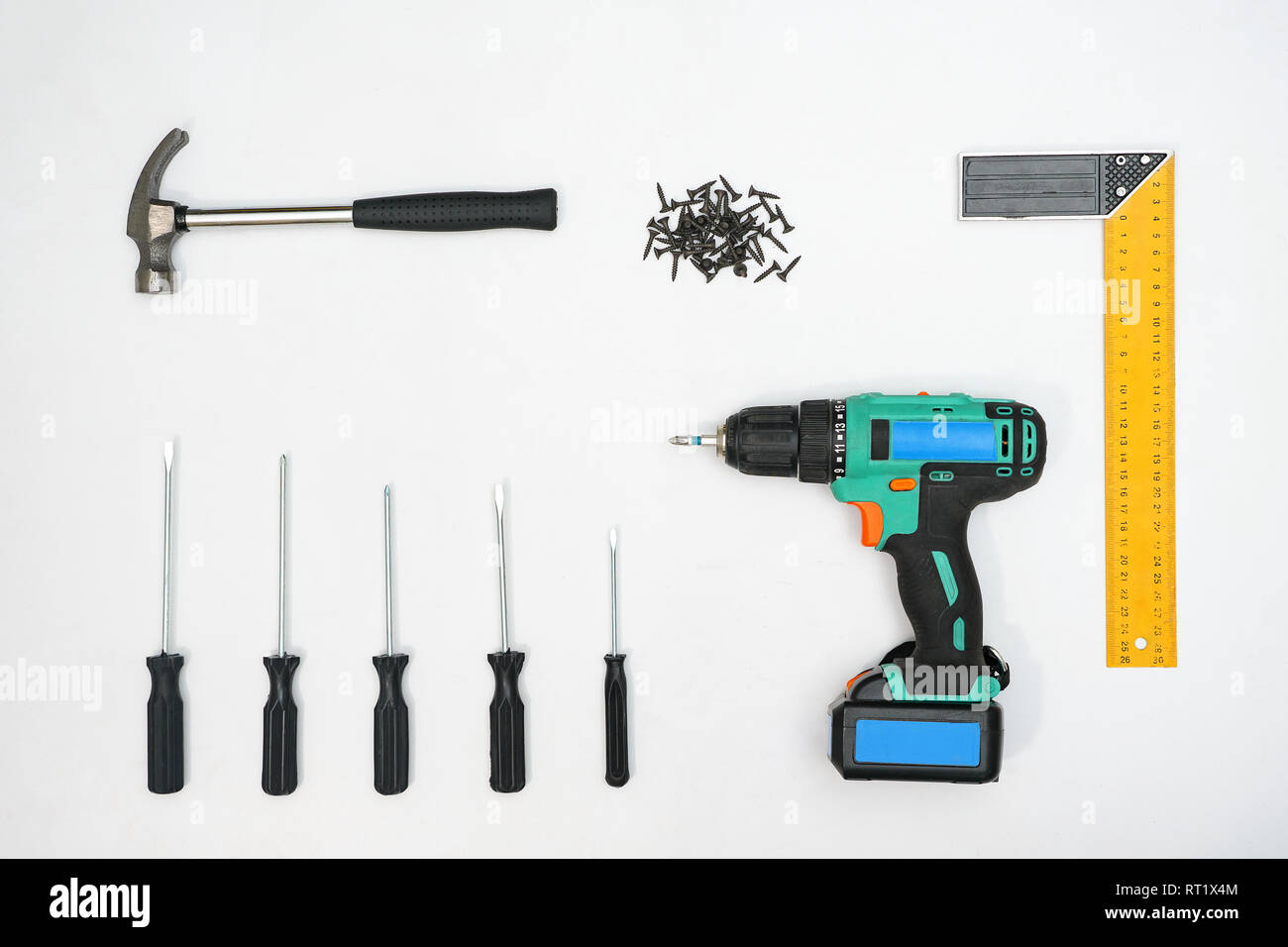Collection of instruments and nails on white backdrop Stock Photo