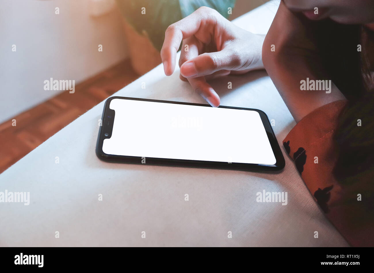 Close up of womans hands using smartphone touchscreen. Stock Photo