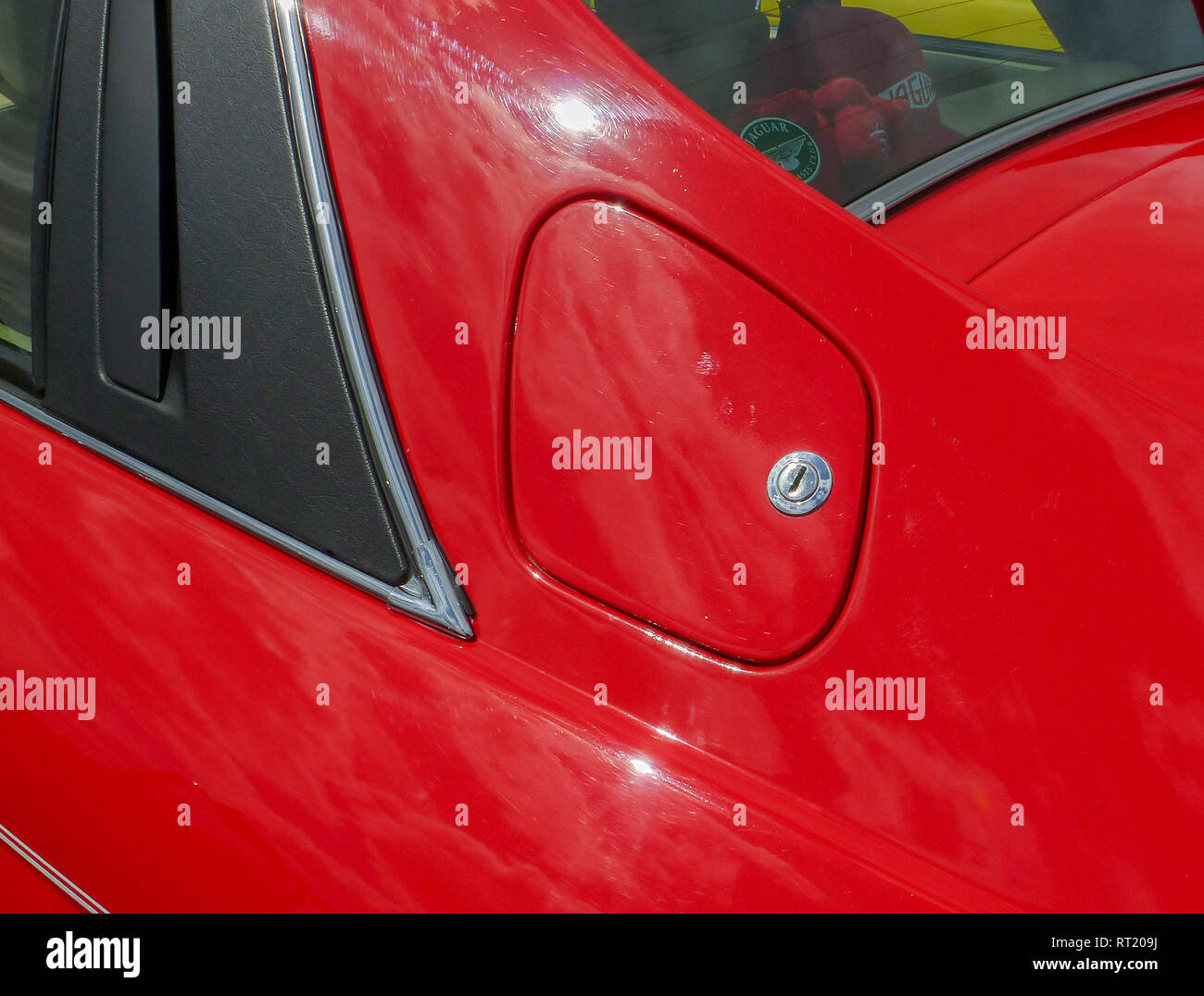 Jaguar XJ S locked fuel filler cap red Stock Photo