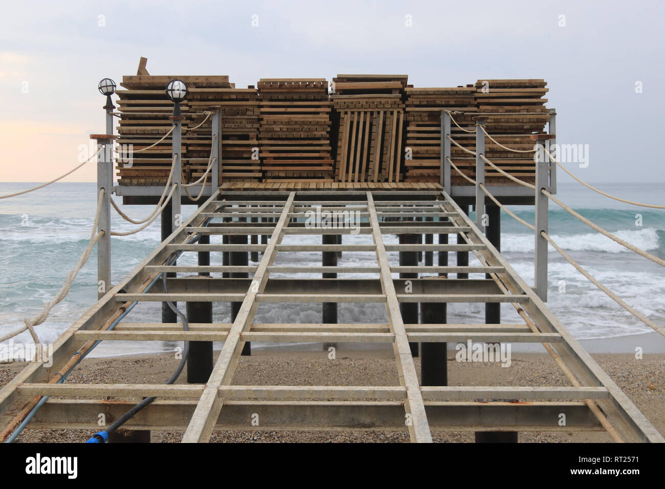 Wooden pallets pier protect the entrance to the dangerous pier Stock