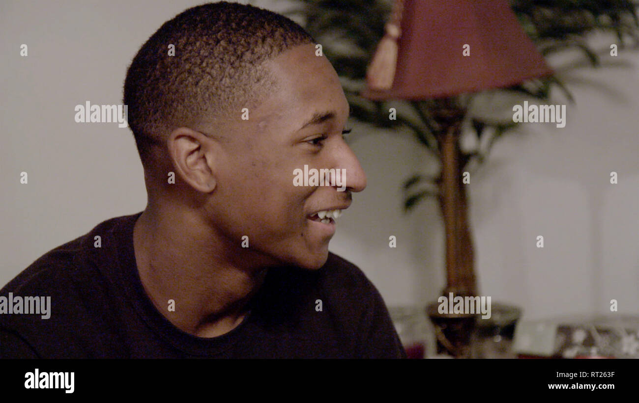 WRESTLE, Jaquan Rhodes laughing at his mom's joke, 2018. © Oscilloscope