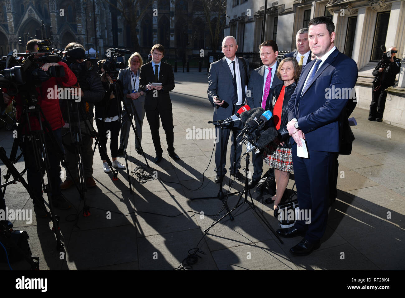 Geraldine Finucane, the widow of murdered Belfast solicitor Pat Finucane, accompanied by her sons John (right) and Michael (to her left) speaks with reporters outside the Supreme Court in central London, after the family lost a Supreme Court challenge over the decision not to hold a public inquiry into his killing, but won a declaration that an effective investigation into his death has not been carried out. Stock Photo