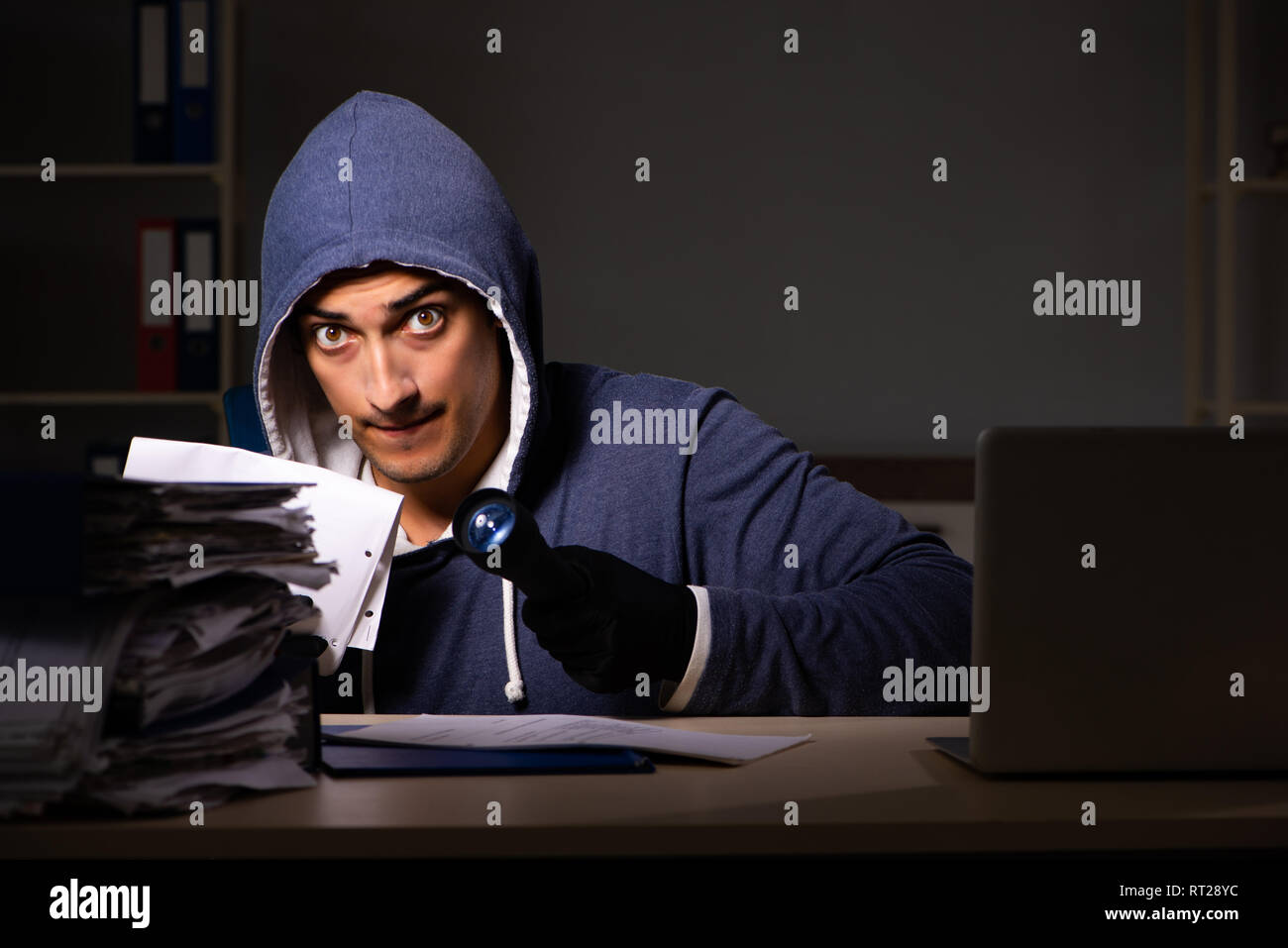 Thief trying to steal personal data in identity theft concept Stock Photo