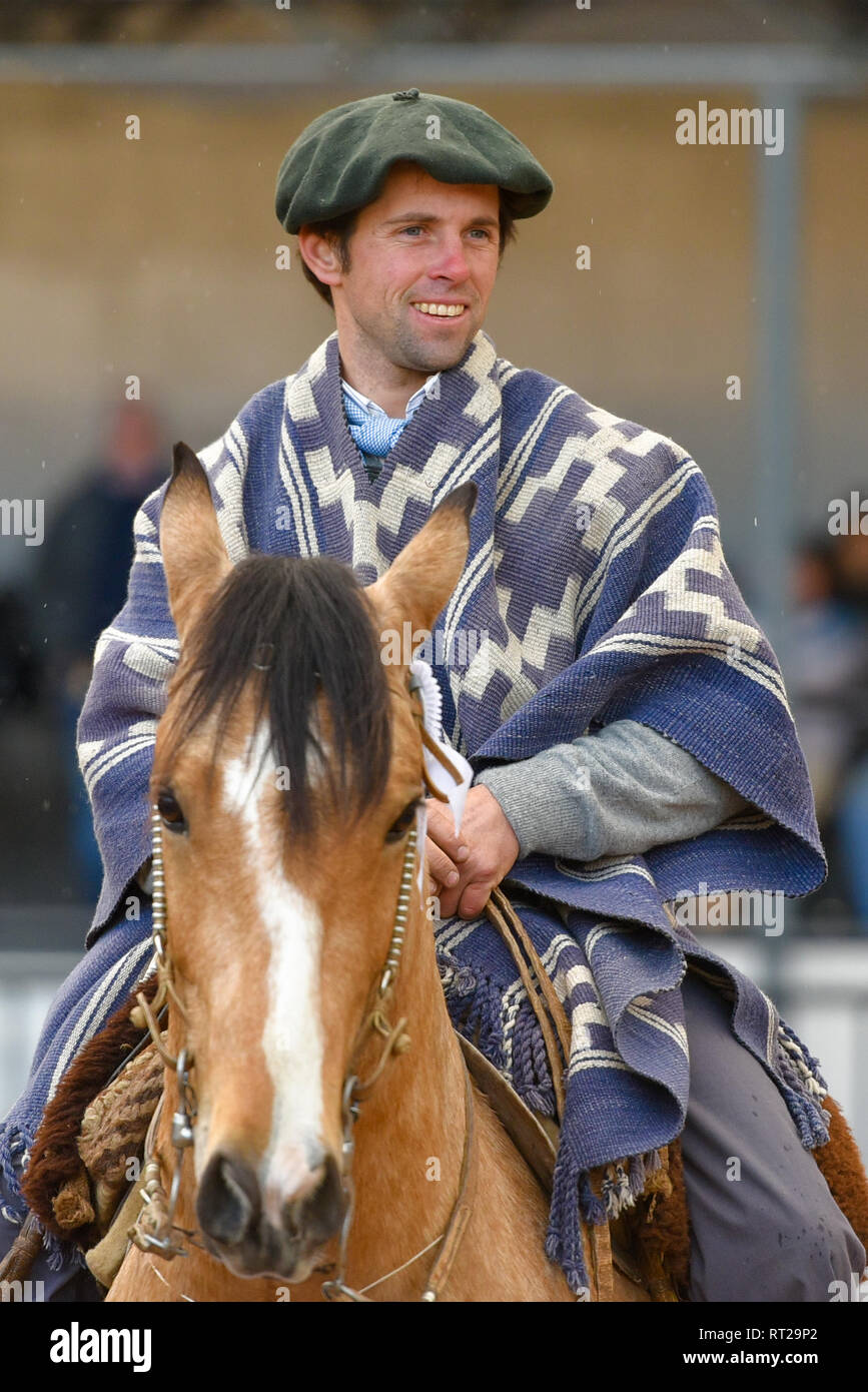 Buenos Aires, Argentina - Jul 16, 2016: A gaucho cowboy riding a horse during a show at the Rural Exhibition. Stock Photo