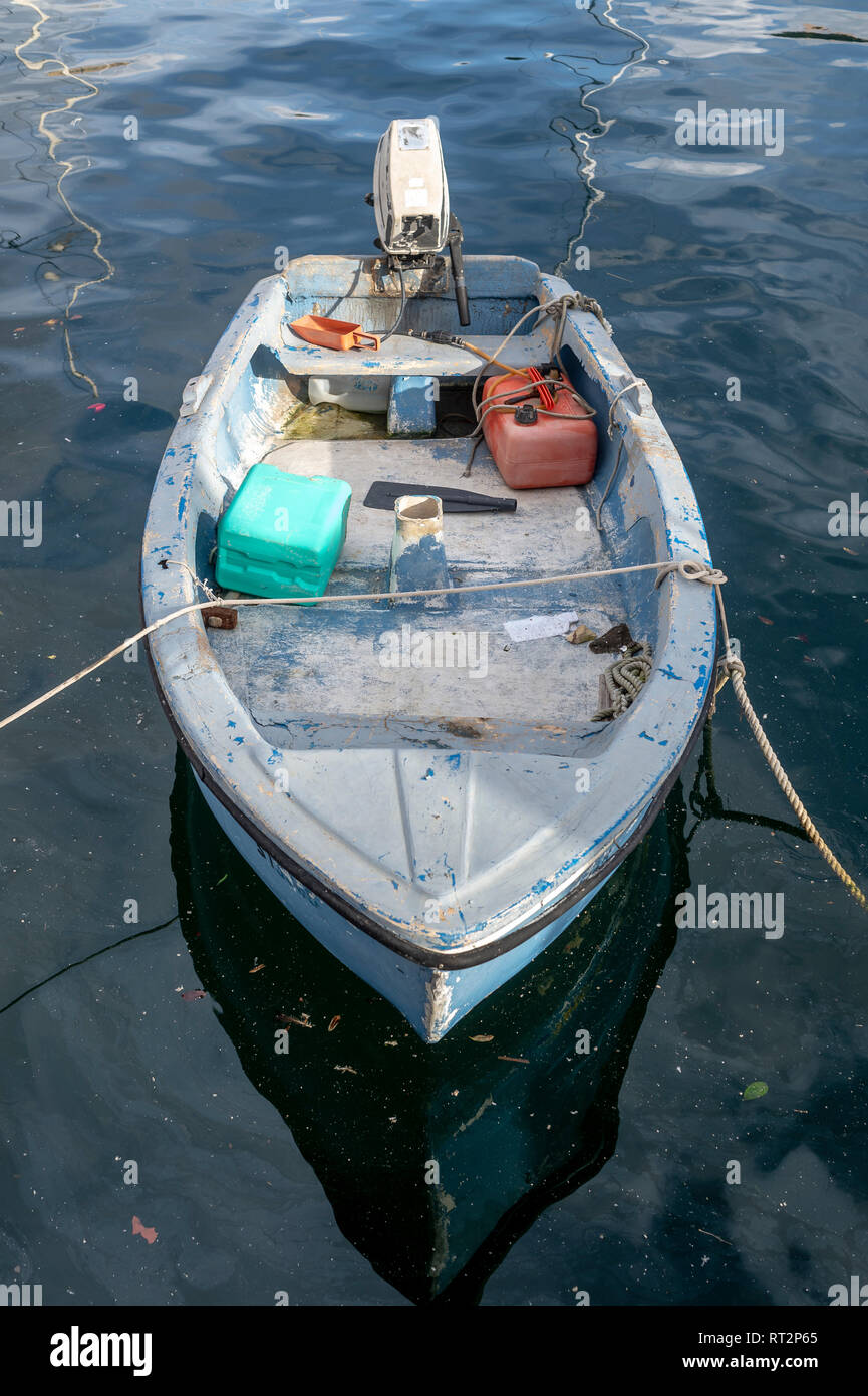 small GRP boat with outboard engine moored in Malta Stock Photo