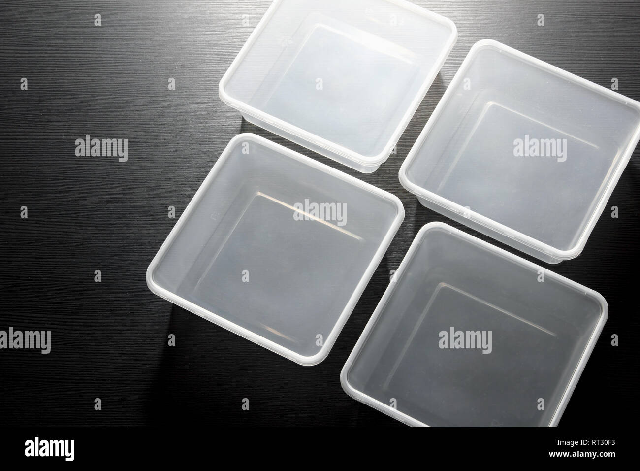 Plastic Containers on Wooden Blackground Stock Photo