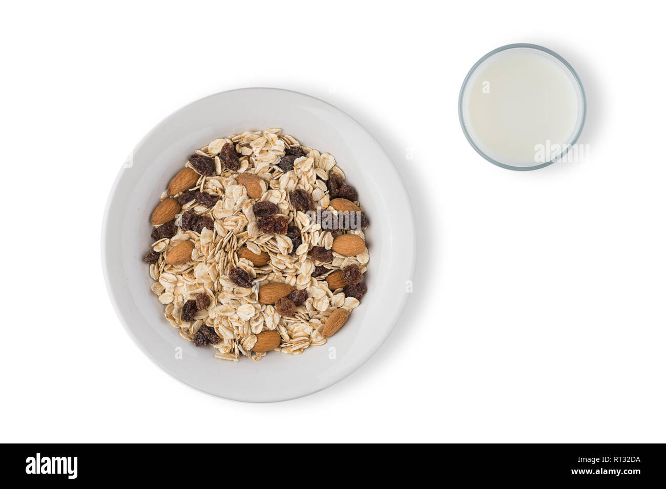 white plate with oat flakes on white background Stock Photo