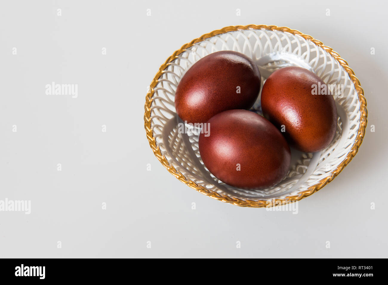 Easter painted brown eggs on a white background Stock Photo