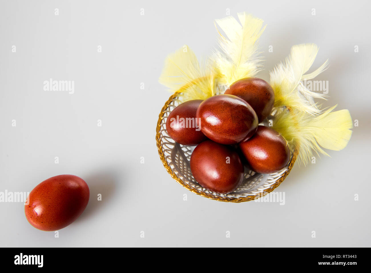 Easter painted brown eggs on a white background Stock Photo