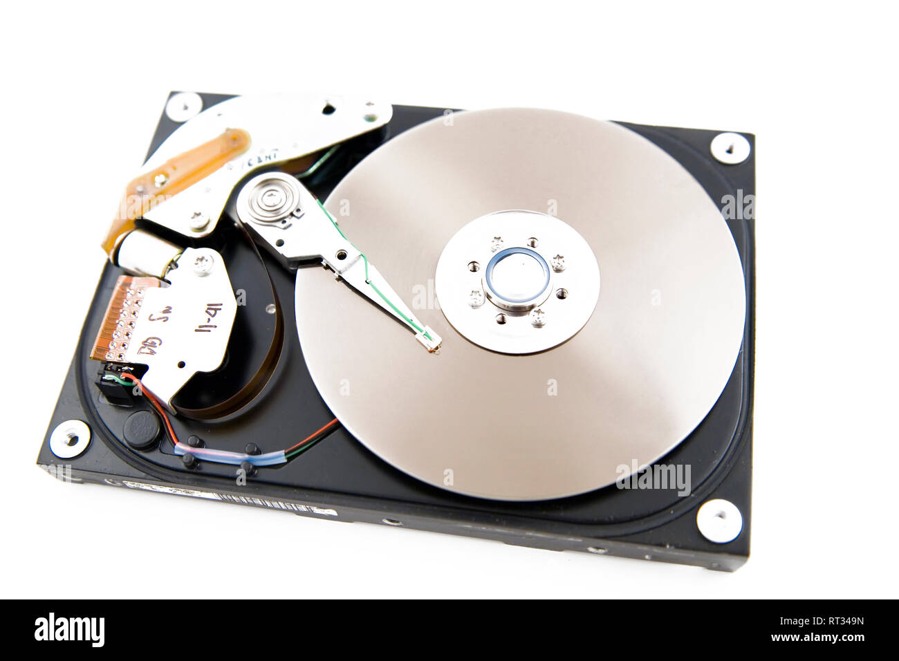 Close-up of the opened hard disc drive on the white background Stock Photo