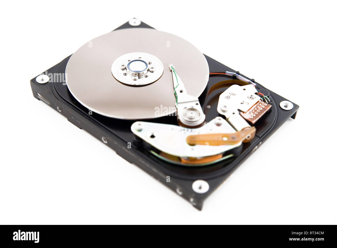Close-up of the opened hard disc drive on the white background Stock Photo