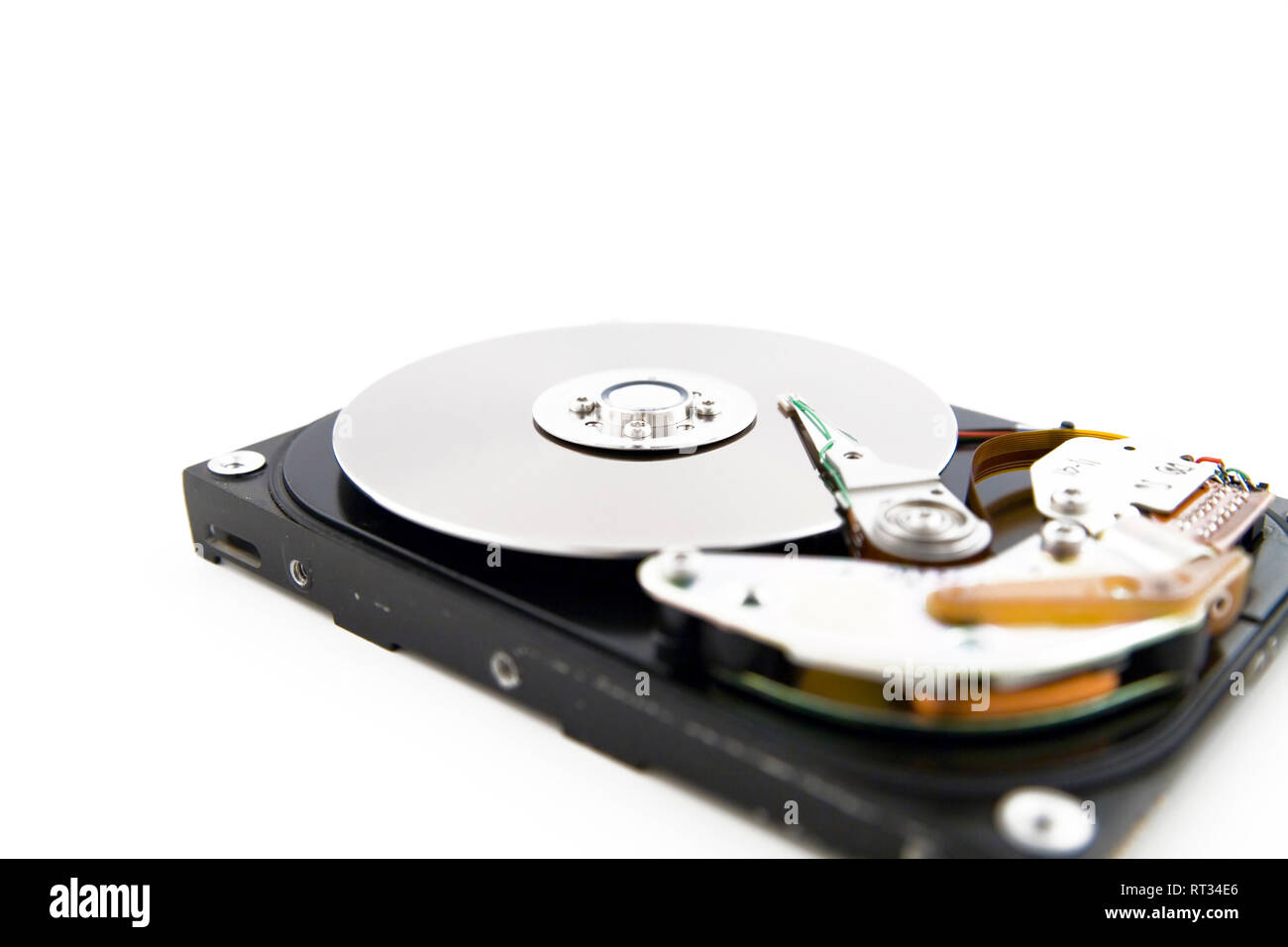 Close-up of the opened hard disc drive on the white background Stock Photo