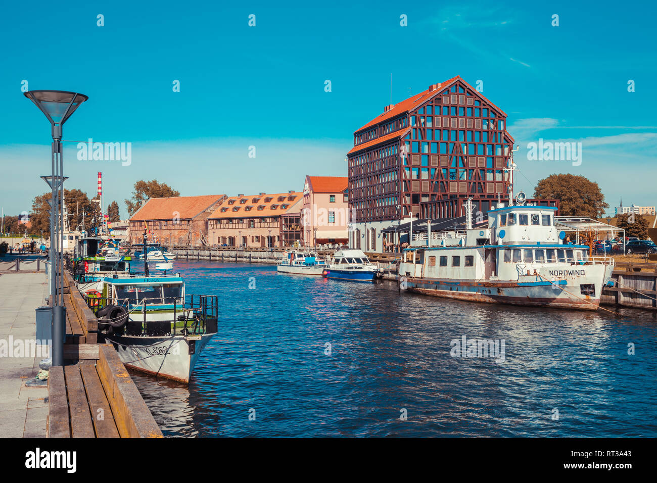Ships and boats on Dane river in oldtown  of Klaipeda. Lithuania. Stock Photo